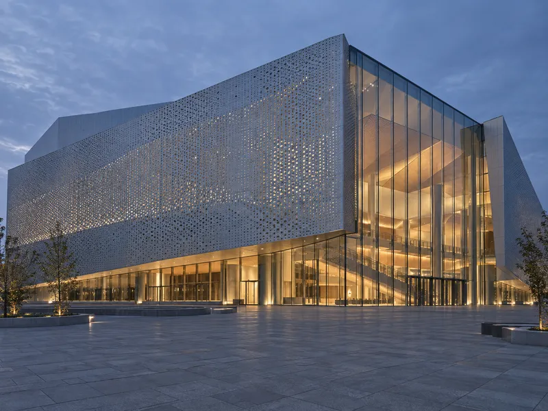 Glass Hall Behind Perforated Facade — AI-generated photograph