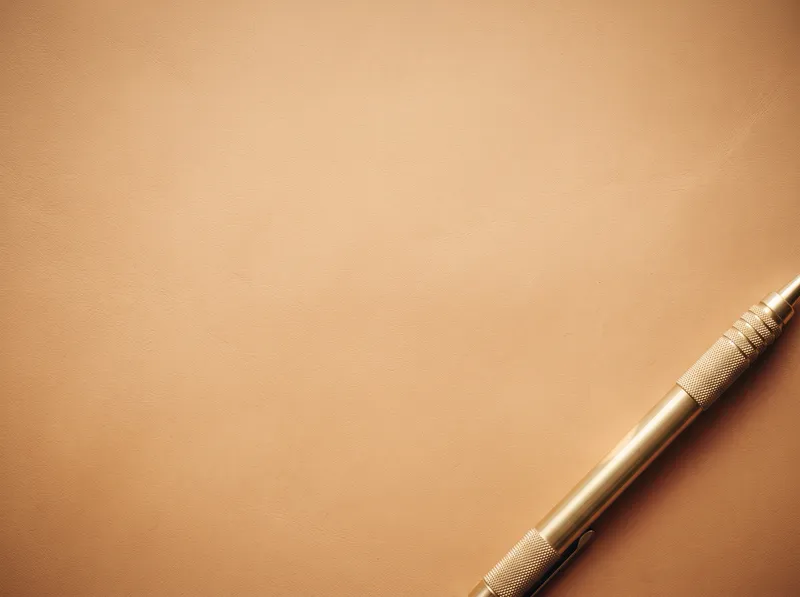 Brass Mechanical Pencil on Caramel Leather — AI-generated photograph
