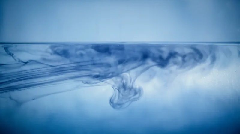 Indigo Ink Blooming in Pale Blue Water — AI-generated photograph