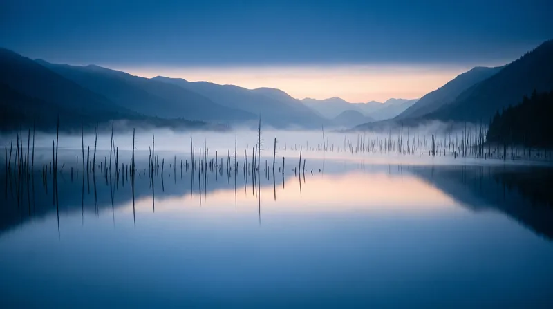 Dead Trees in Lake Mist at Dawn — AI-generated photograph