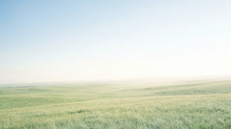 Green Highland Meadow under a Pale Blue Sky — AI-generated photograph