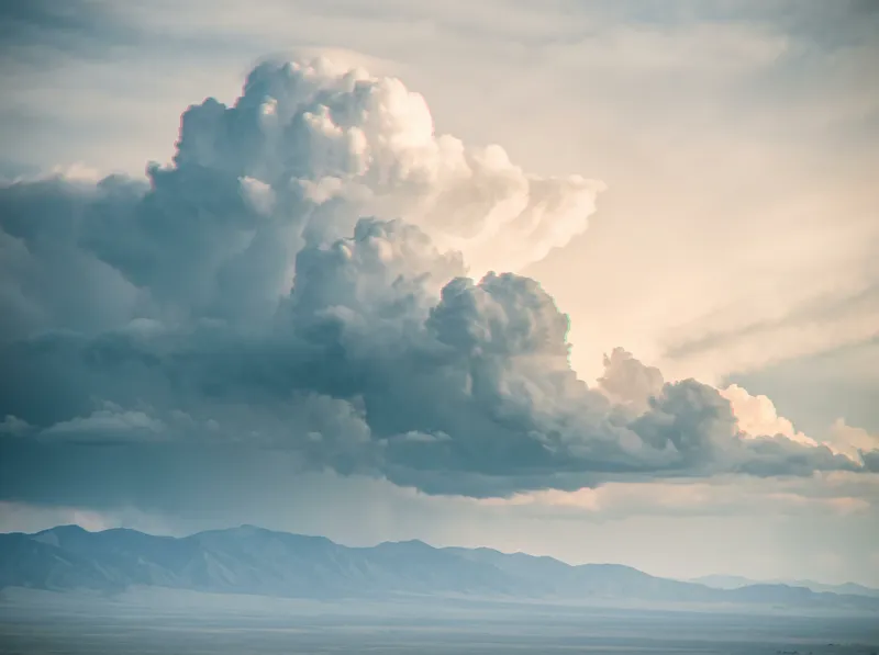 Distant Cumulonimbus Tower Over a Hazy Plain — AI-generated photograph