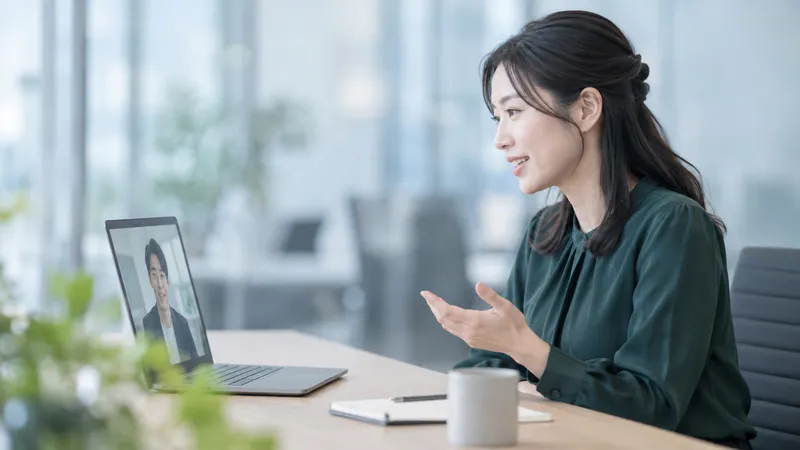 Woman Speaking to a Laptop Screen — AI-generated photograph