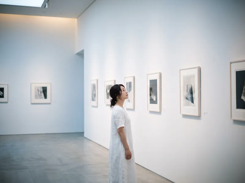 Artist in a Bright White Gallery — AI-generated photograph