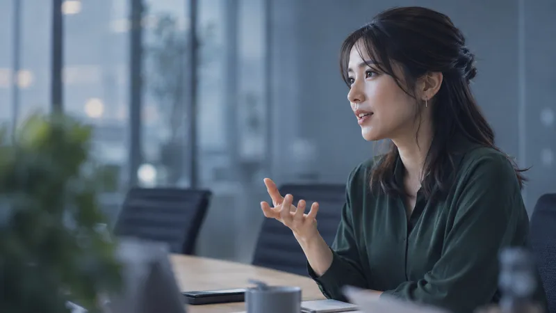 Woman Gesturing at an Office Table — AI-generated photograph