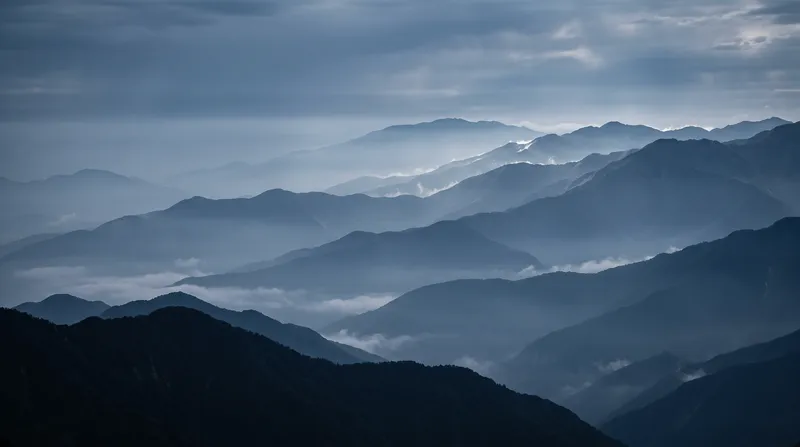Layered Mountain Ridges in Blue Haze — AI-generated photograph