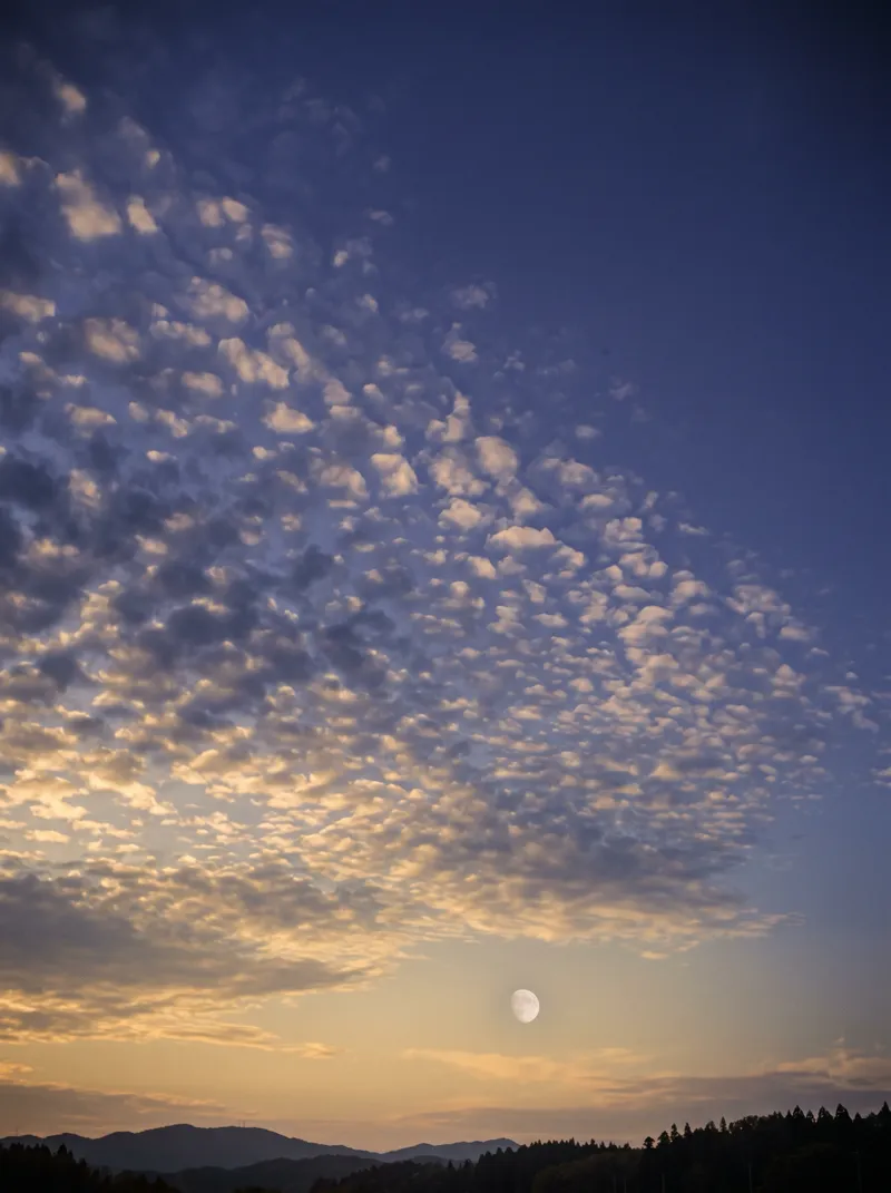 Mackerel Clouds and Pale Moon at Autumn Dusk — AI-generated photograph