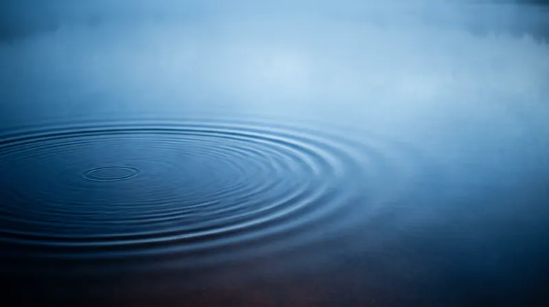 Blue Ripples Spreading on Still Water — AI-generated photograph